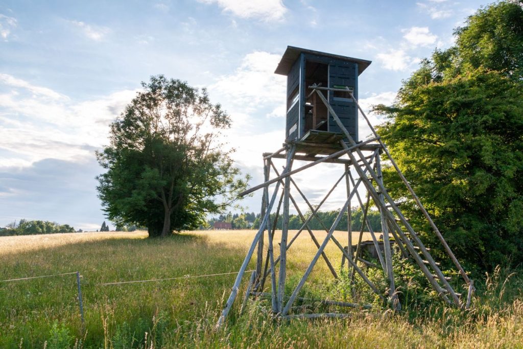 wooden hunting watch tower in a field